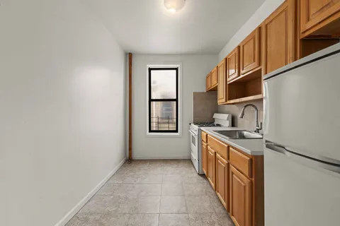 a kitchen with stainless steel appliances granite countertop a stove and a sink