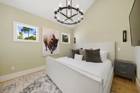 a living room with a flat screen tv and a window