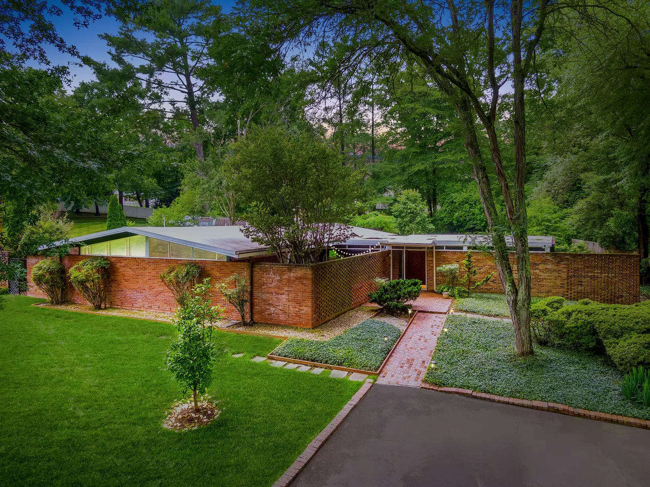 a view of a backyard with chairs and a small yard