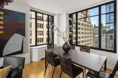 a view of a dining room with furniture and window