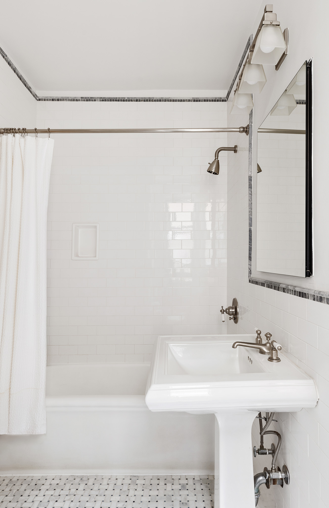 174 West 76th Street, Unit 4GH Manhattan, NY 10023 - Photo 13 of 16 a bathroom with a sink a mirror and a shower