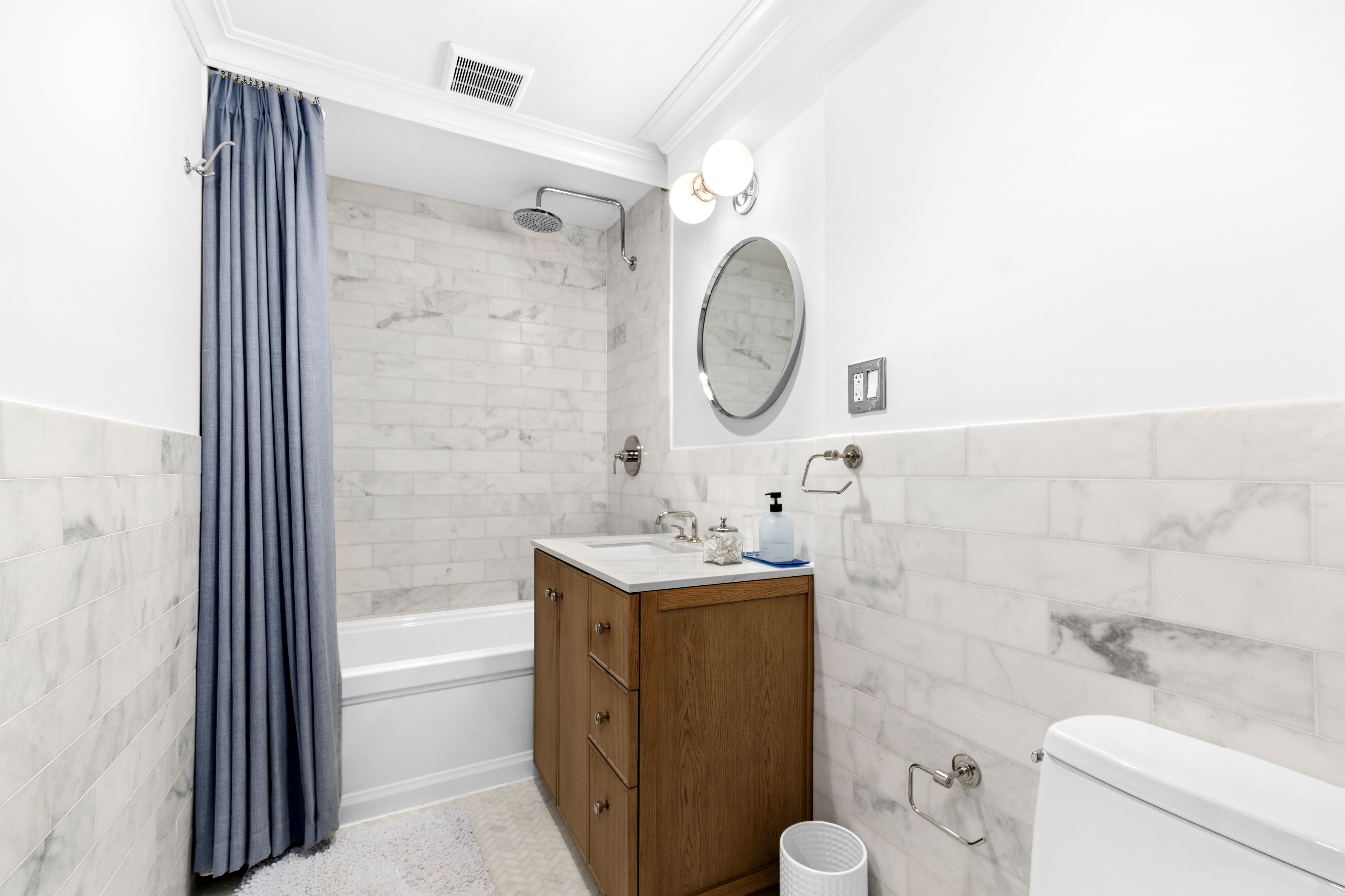 191 MacDonough Street, Unit 2 Brooklyn, NY 11216 - Photo 3 of 7 a bathroom with a sink mirror toilet and bathtub