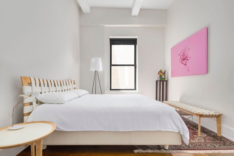 260 Park Avenue South, Unit 12F Manhattan, NY 10010 - Photo 4 of 9 a bedroom with a bed and a table