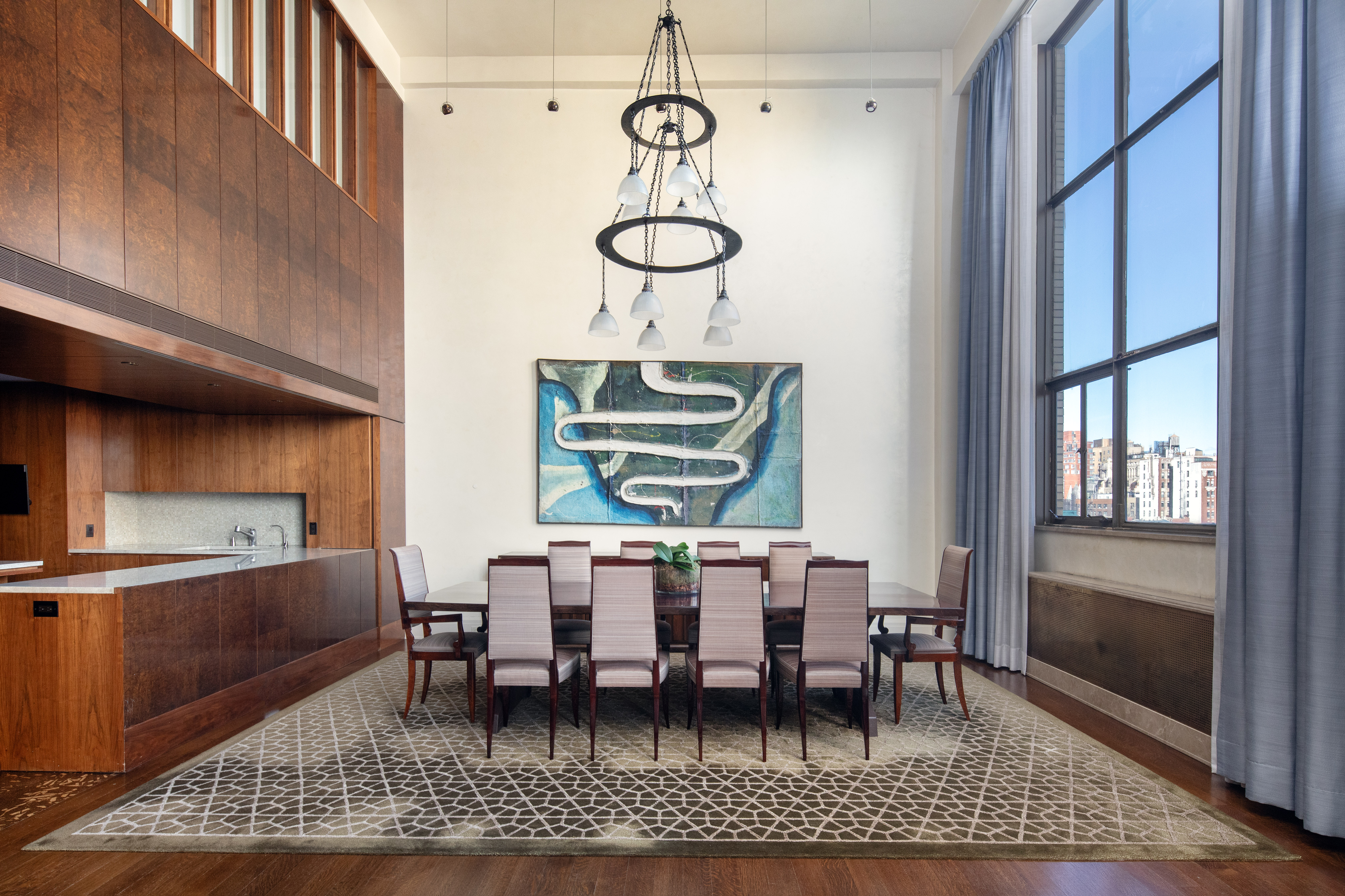 1 West 67th Street, Unit 606607 Manhattan, NY 10023 - Photo 6 of 15 a view of a dining room with furniture