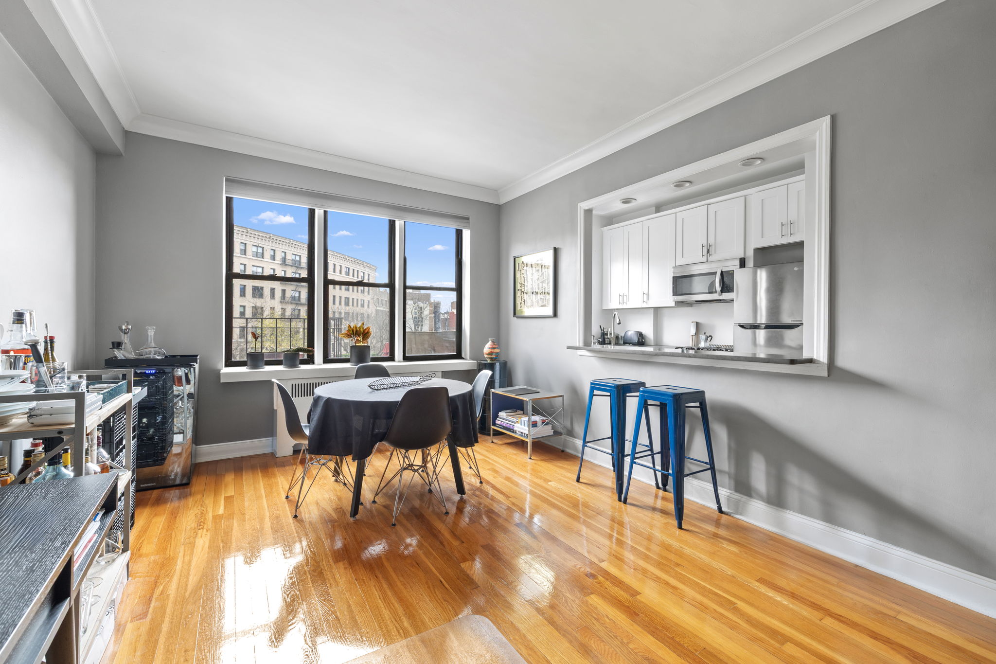 Riverside Dr W, Unit 6H Manhattan, NY 10032 - Photo 4 of 6 a living room with furniture and a table