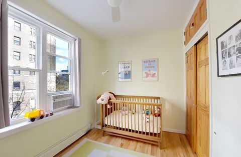 a view of front door with wooden floor and a window