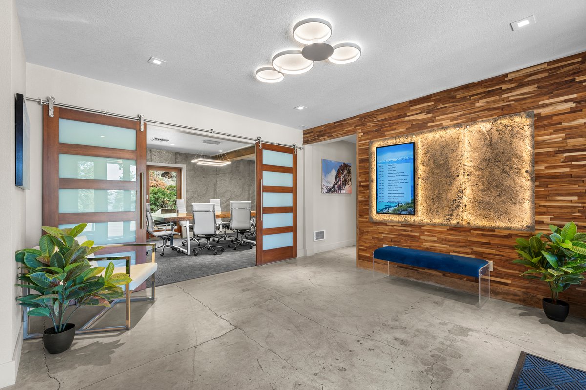 625 Highway 50 Zephyr Cove, NV 89448 - Photo 3 of 38 a living room with furniture potted plant and couches next to a large window