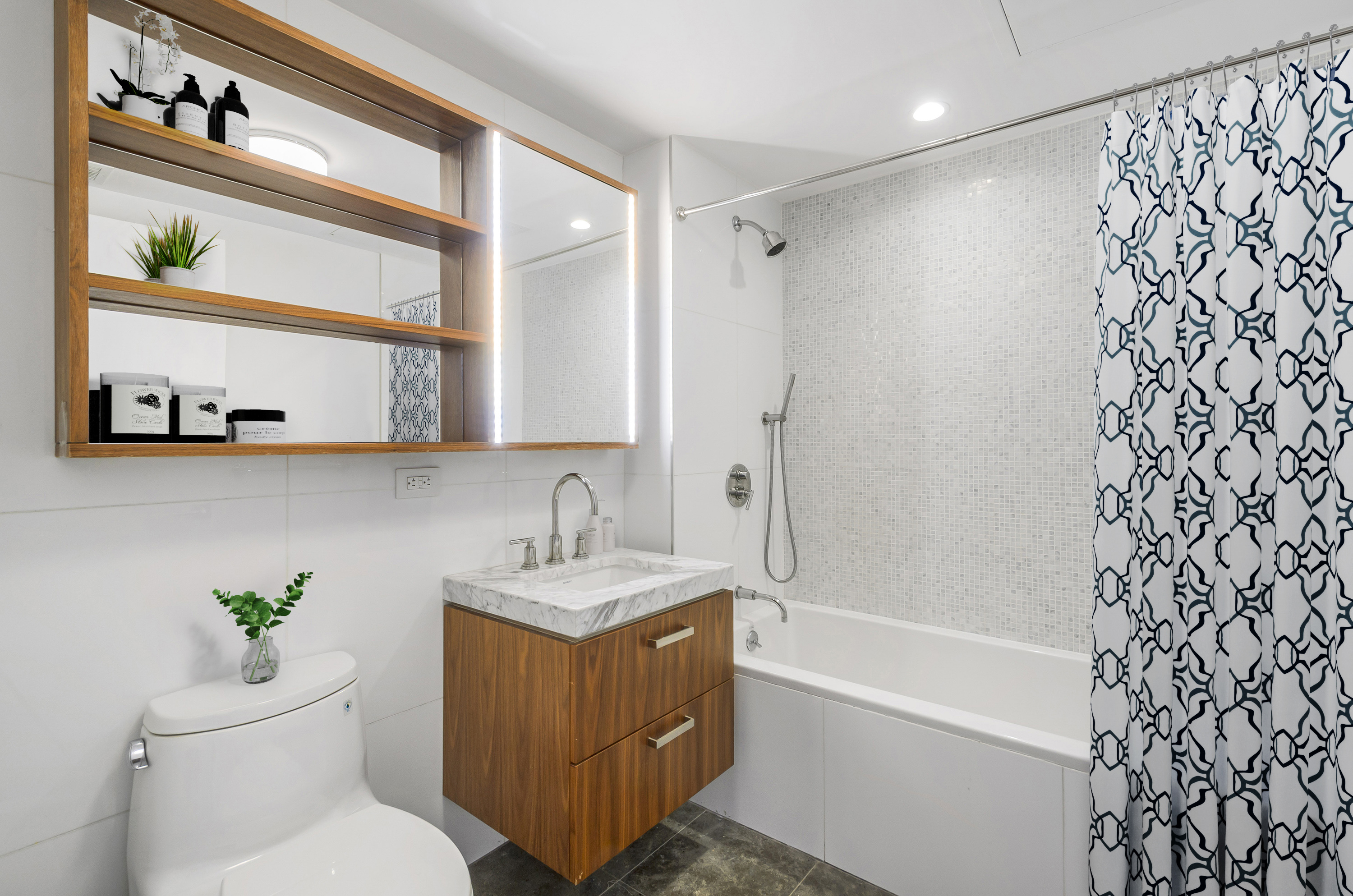 476 Union Avenue, Unit PH5A Brooklyn, NY 11211 - Photo 12 of 17 a bathroom with a sink a toilet and shower