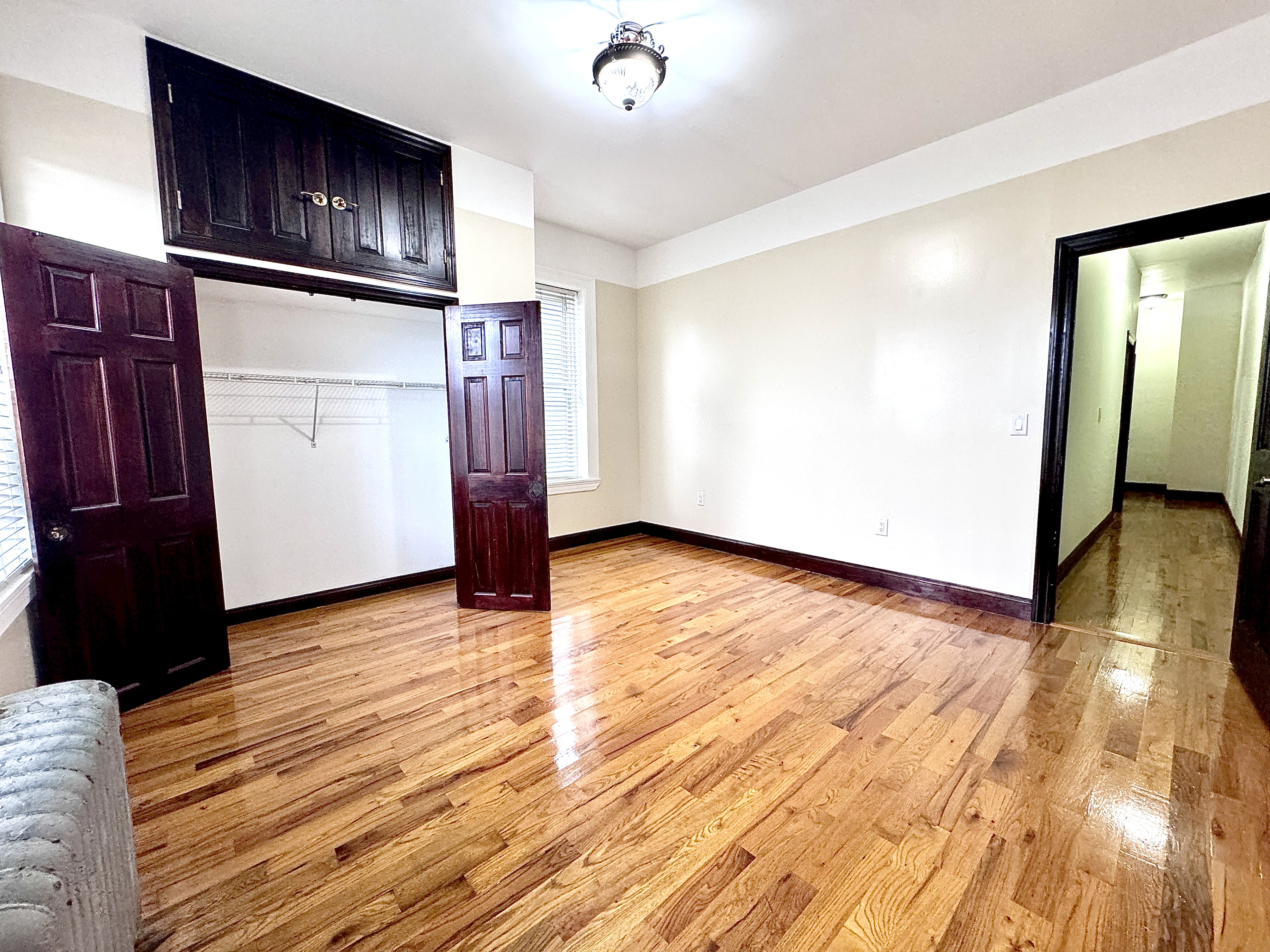 497 Park Place, Unit 4 Brooklyn, NY 11238 - Photo 2 of 14 a view of empty room with wooden floor