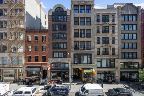 a front view of a building with multiple windows