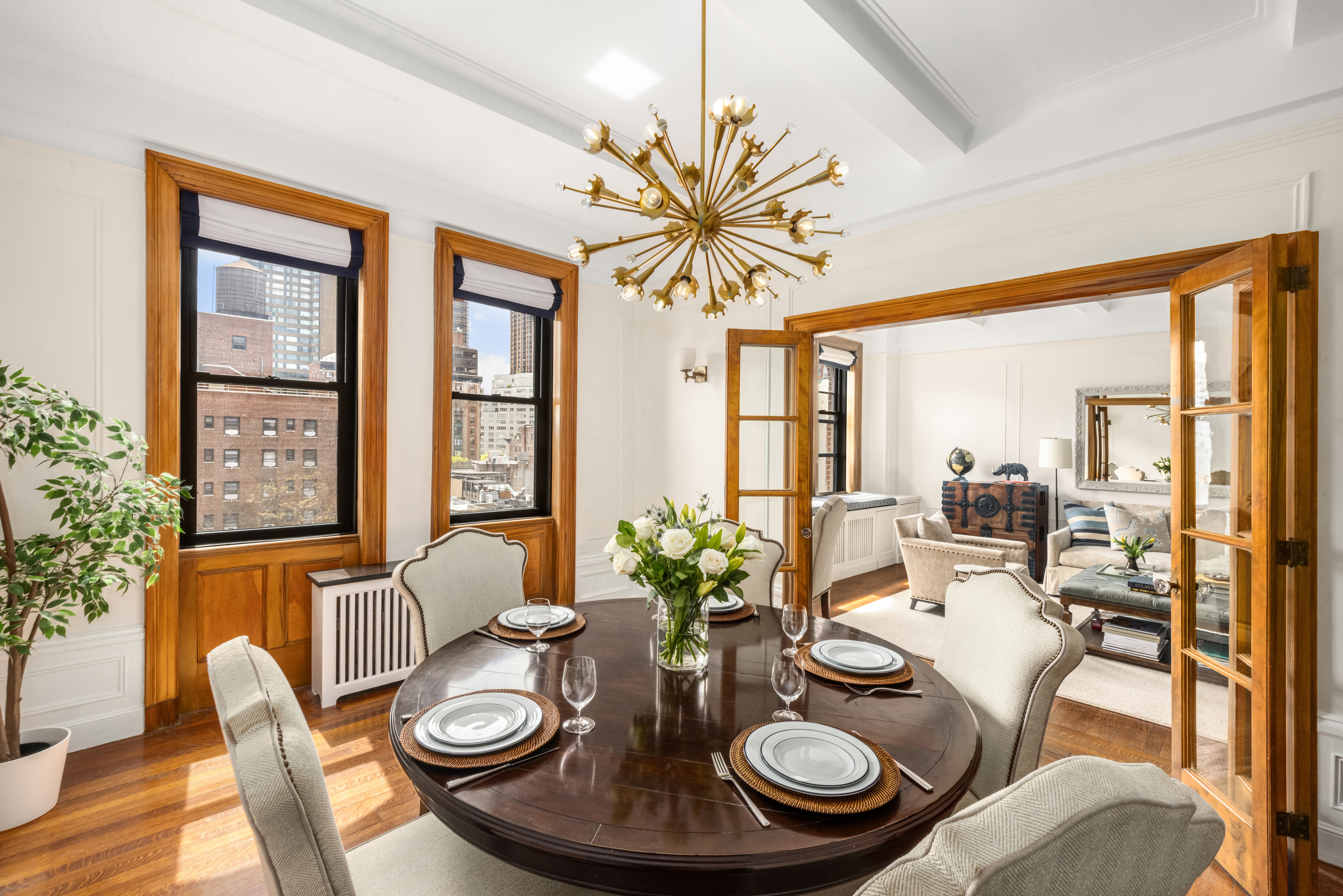 119 West 71st Street, Unit 9B Manhattan, NY 10023 - Photo 2 of 18 a view of a dining room with furniture window and wooden floor