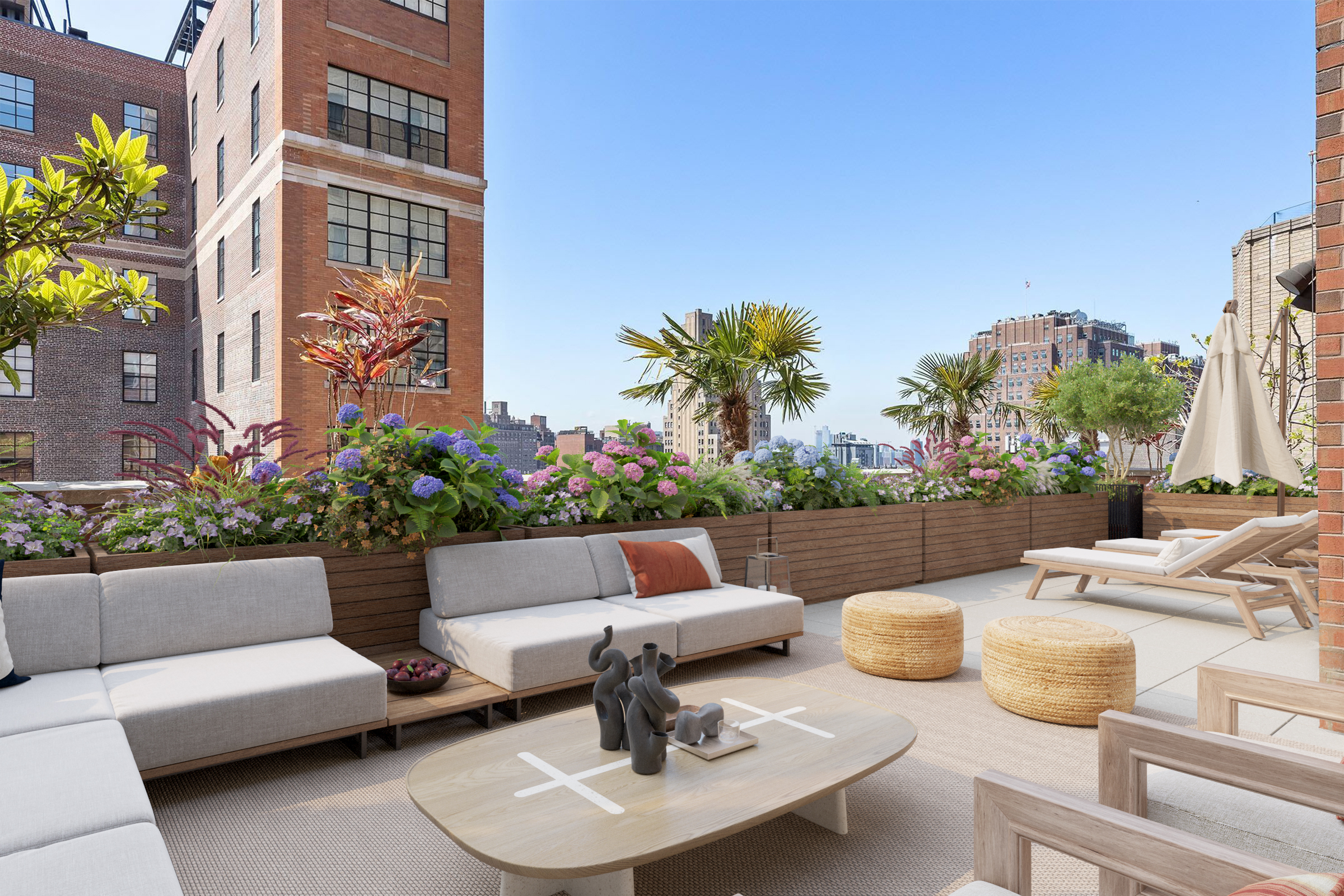 201 West 17th Street, Unit PHF Manhattan, NY 10011 - Photo 17 of 22 a view of a patio with couches and a potted plant on a table