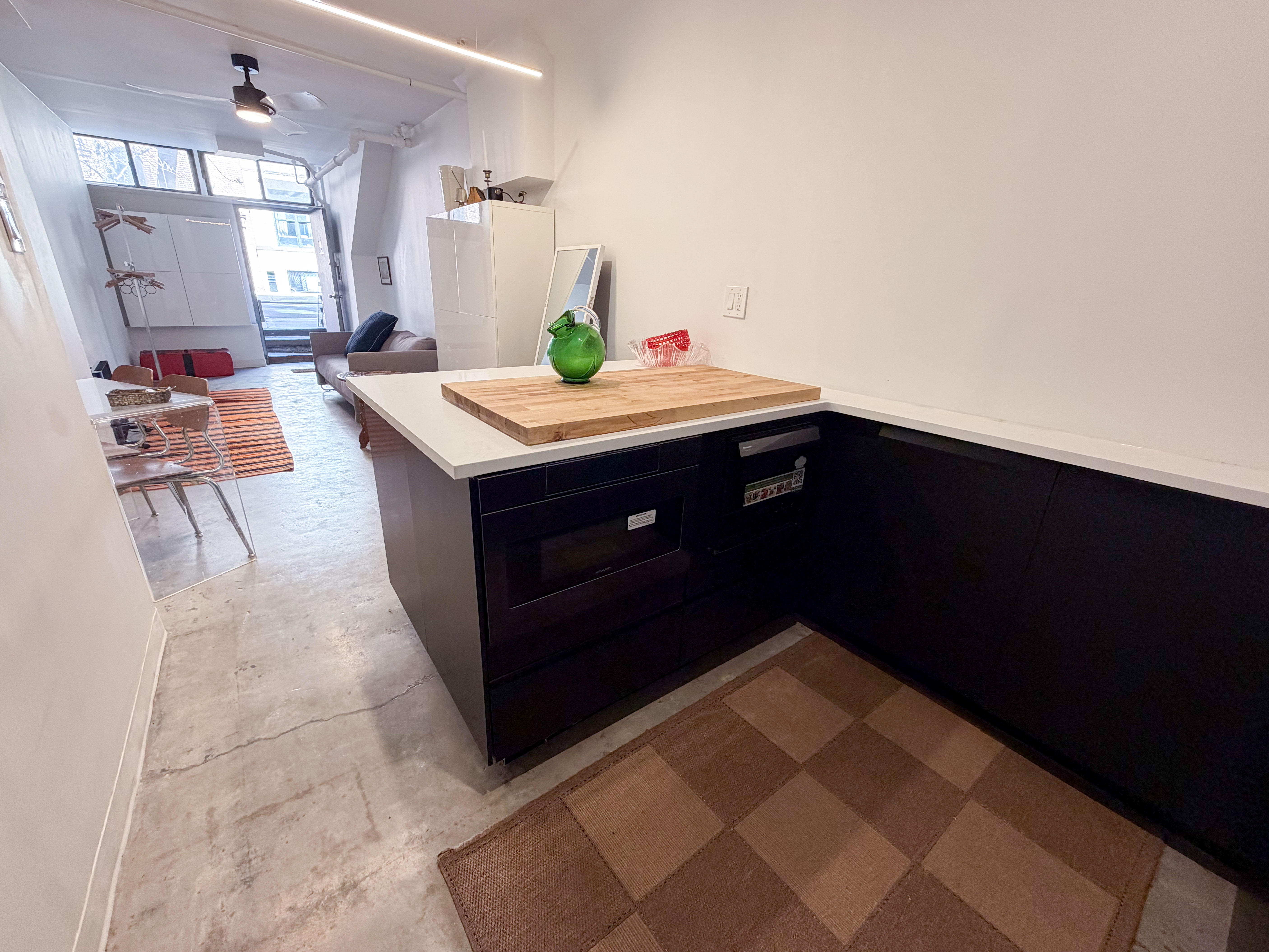 206 East 7th Street, Unit G Manhattan, NY 10009 - Photo 15 of 22 a kitchen with a sink and cabinets