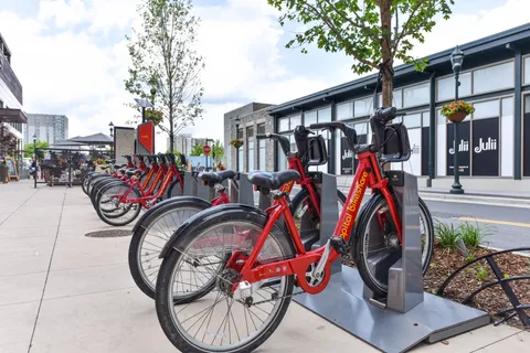 a view of bike storage next to a yard