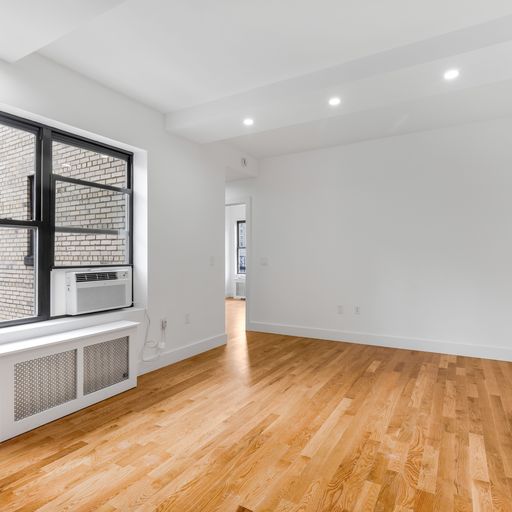 317 West 87th Street, Unit 8C Manhattan, NY 10024 - Photo 5 of 9 wooden floor in an empty room with a window