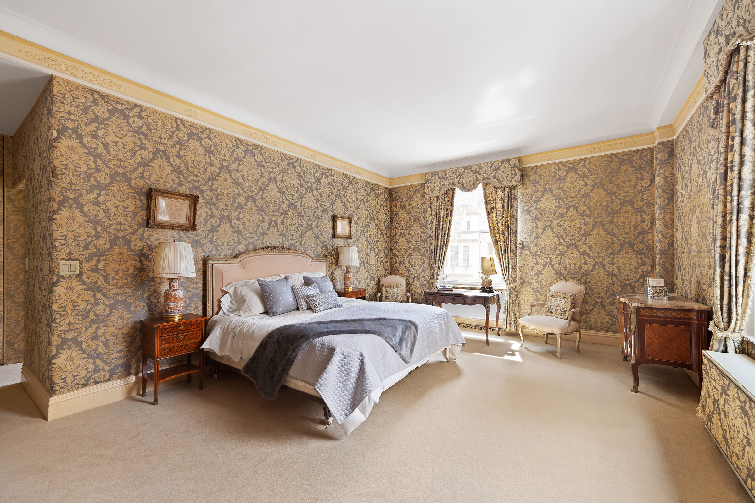 31 East 72nd Street, Unit 4B Manhattan, NY 10021 - Photo 5 of 14 a bedroom with a bed and large windows