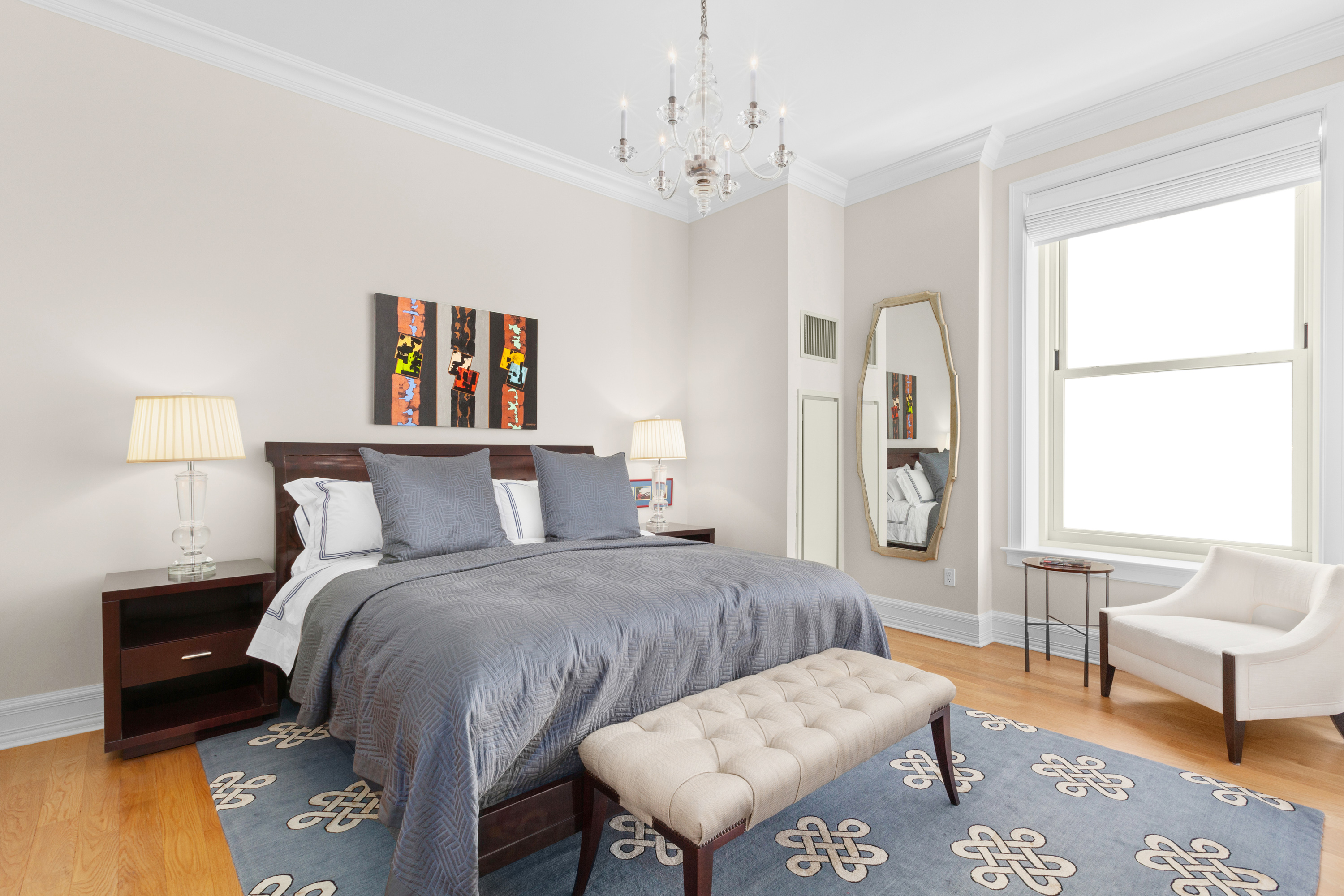 1 Central Park South, Unit 915 Manhattan, NY 10019 - Photo 20 of 29 a bedroom with a bed and a couch