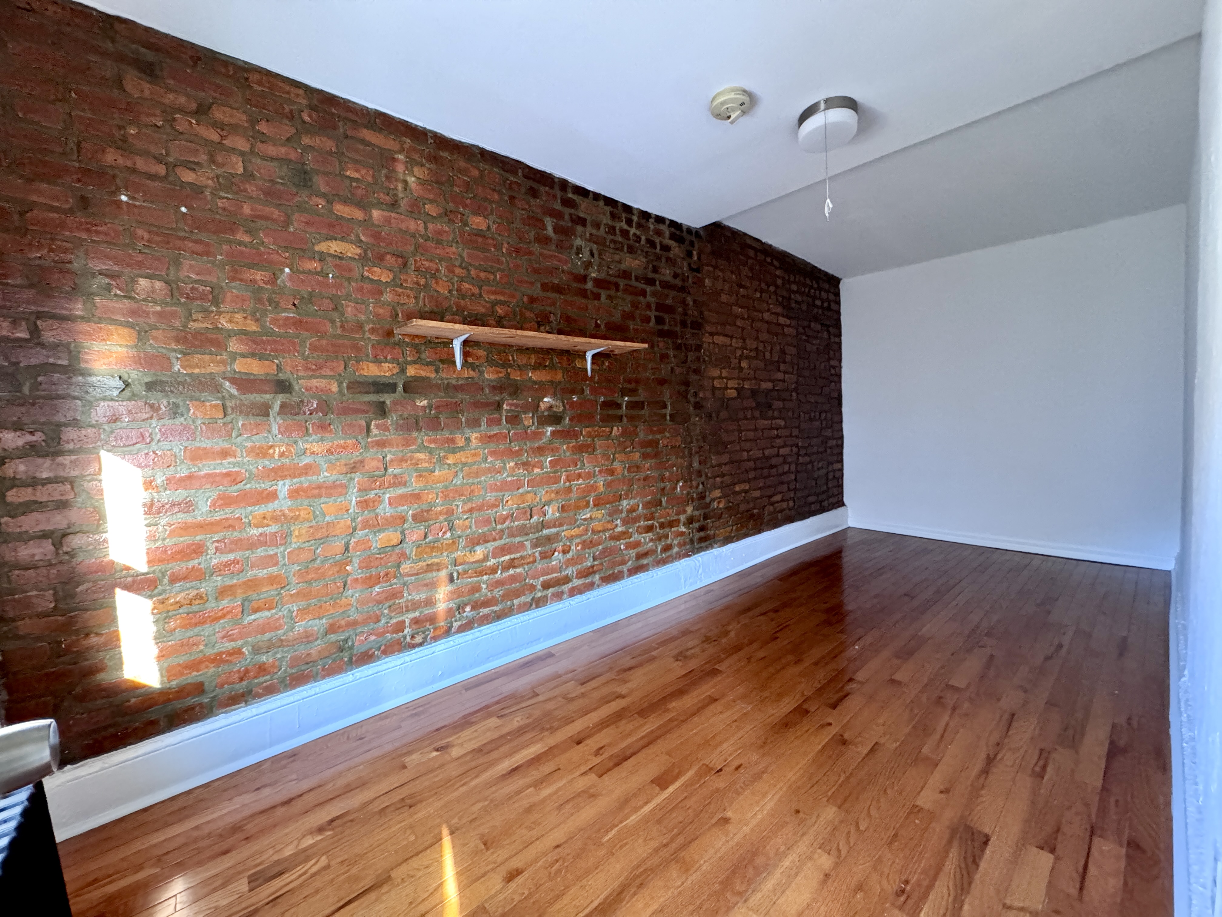 195 Court Street, Unit 4 Brooklyn, NY 11201 - Photo 3 of 11 a view of a room with wooden floor