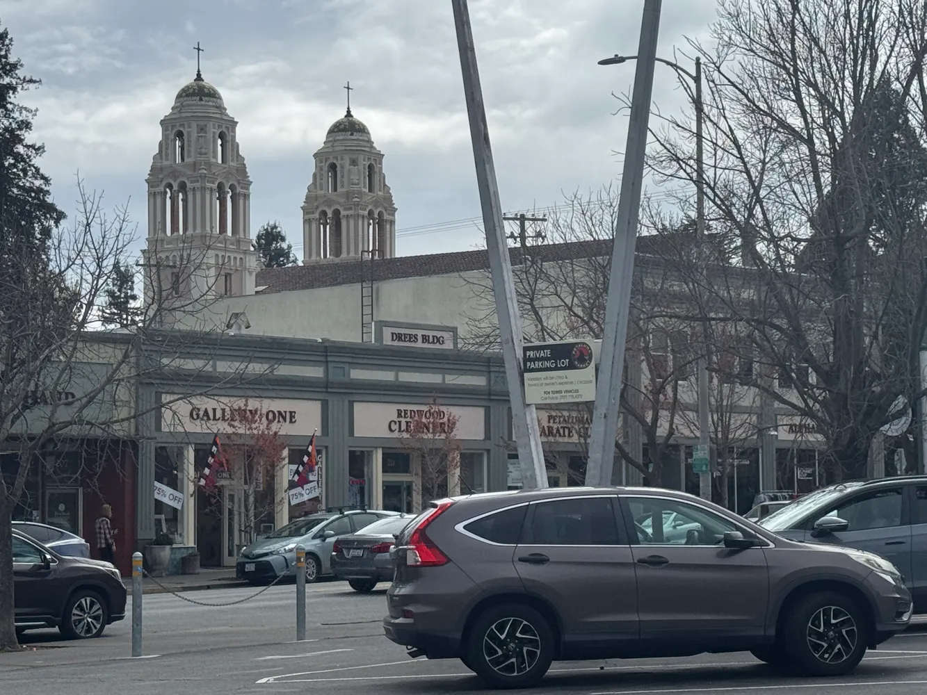 a view of street with parked cars