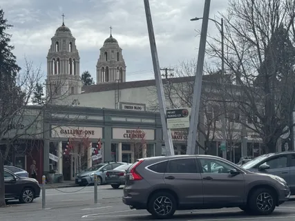 a view of street with parked cars