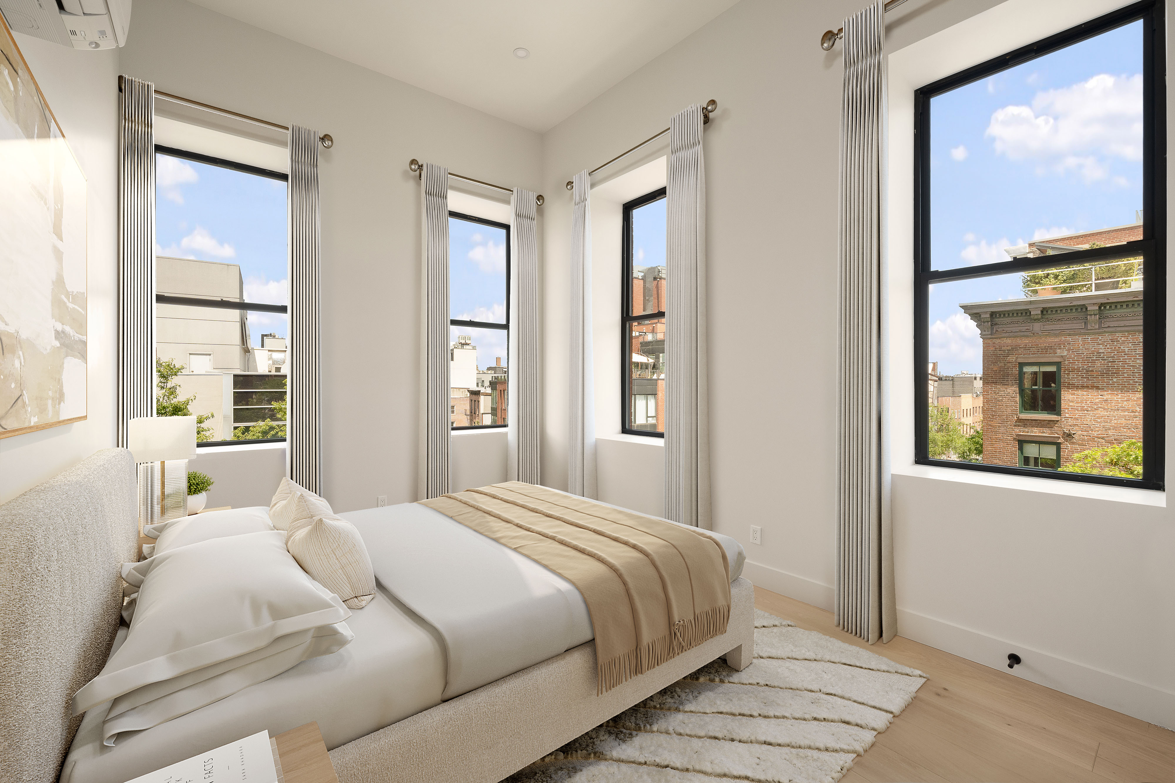 216 Grand Street, Unit LOFT 2 Brooklyn, NY 11211 - Photo 3 of 9 a bedroom with a large window and a glass door