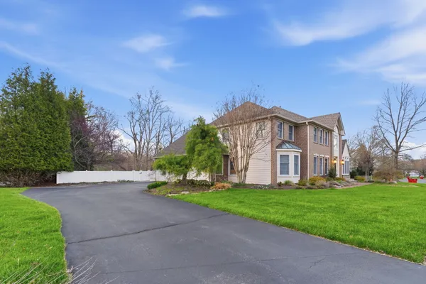 a living room with furniture a rug and a window