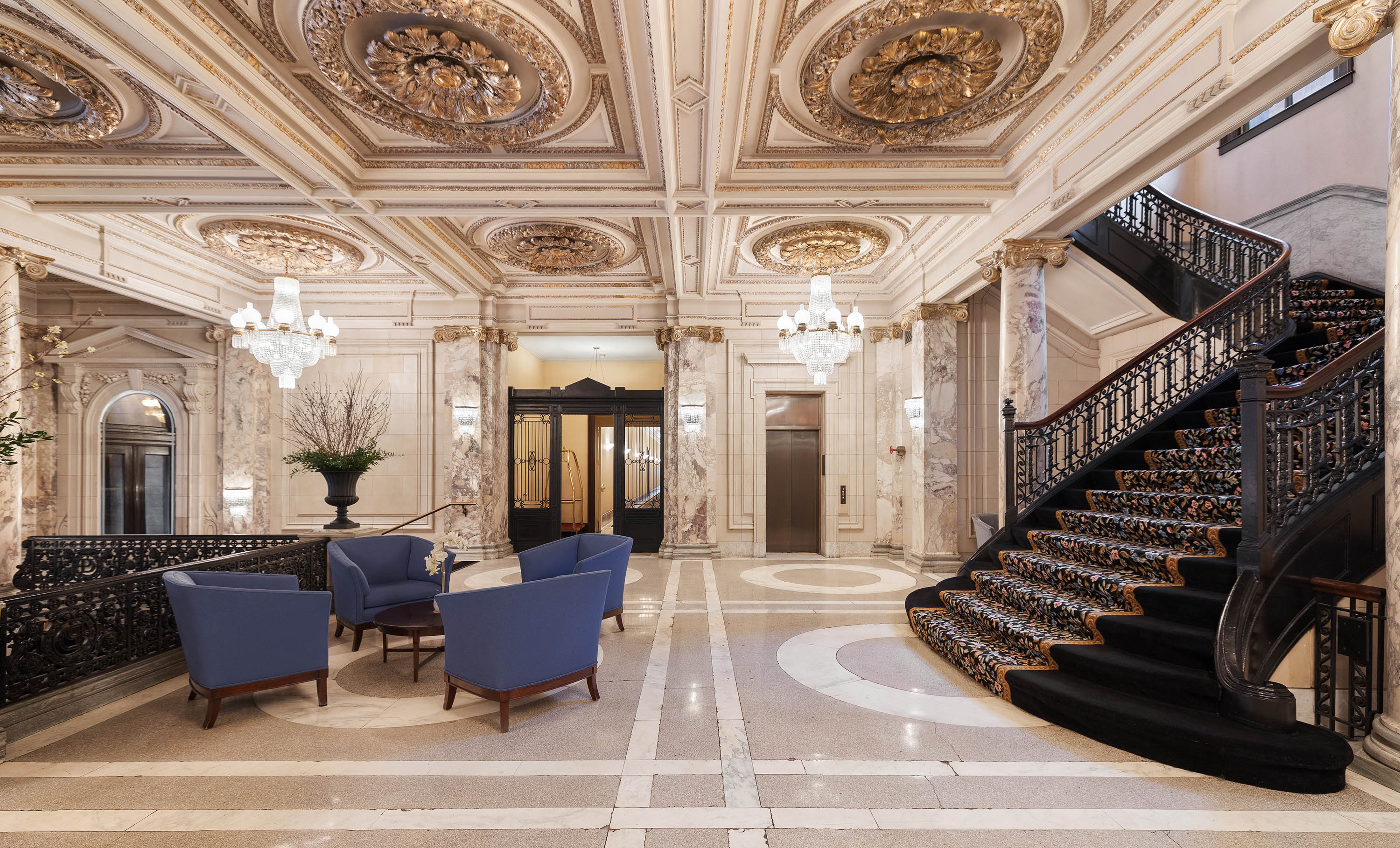 240 Centre Street, Unit 2B Manhattan, NY 10013 - Photo 11 of 12 a living room with lots of furniture and a chandelier