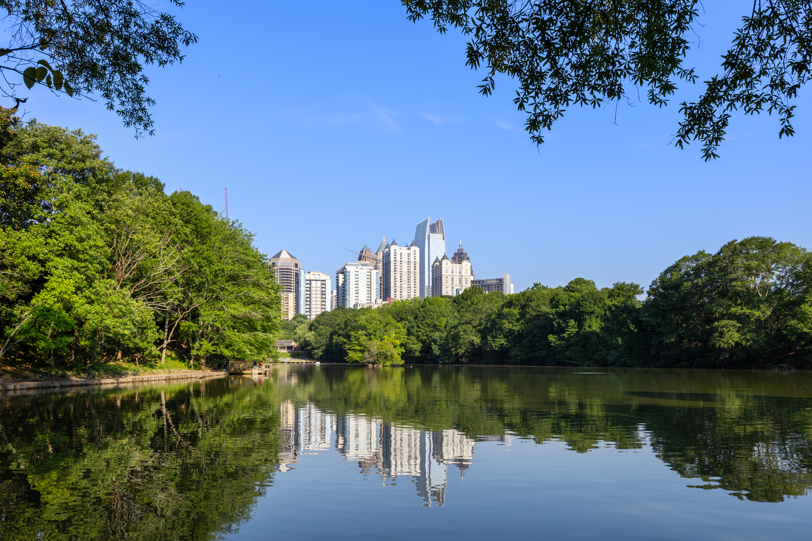 222 12th Street Northeast Atlanta, GA 30309 - Photo 54 of 56 a view of a lake with a building in the background