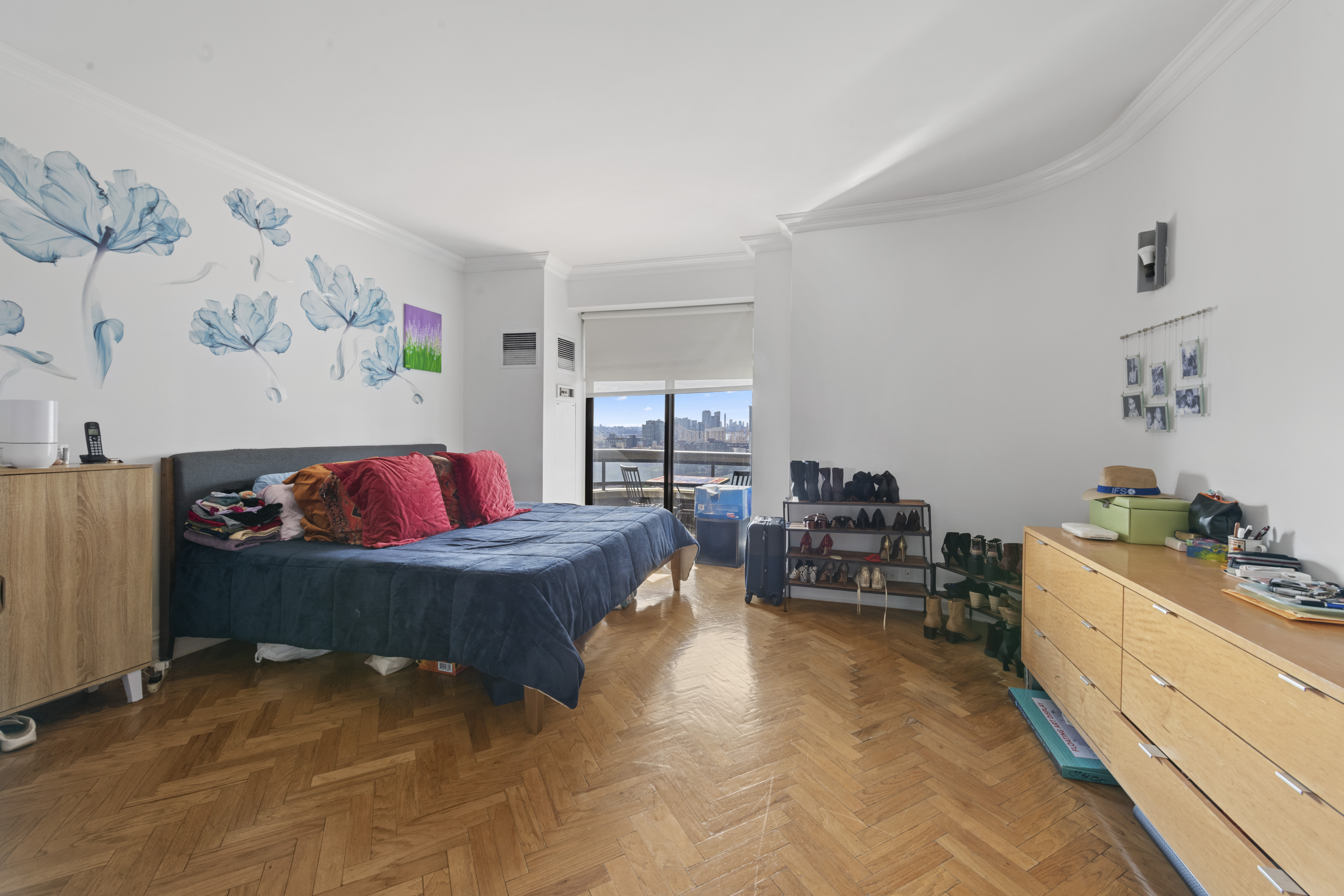 530 East 76th Street Manhattan, NY 10021 - Photo 10 of 20 a living room with furniture and a flat screen tv