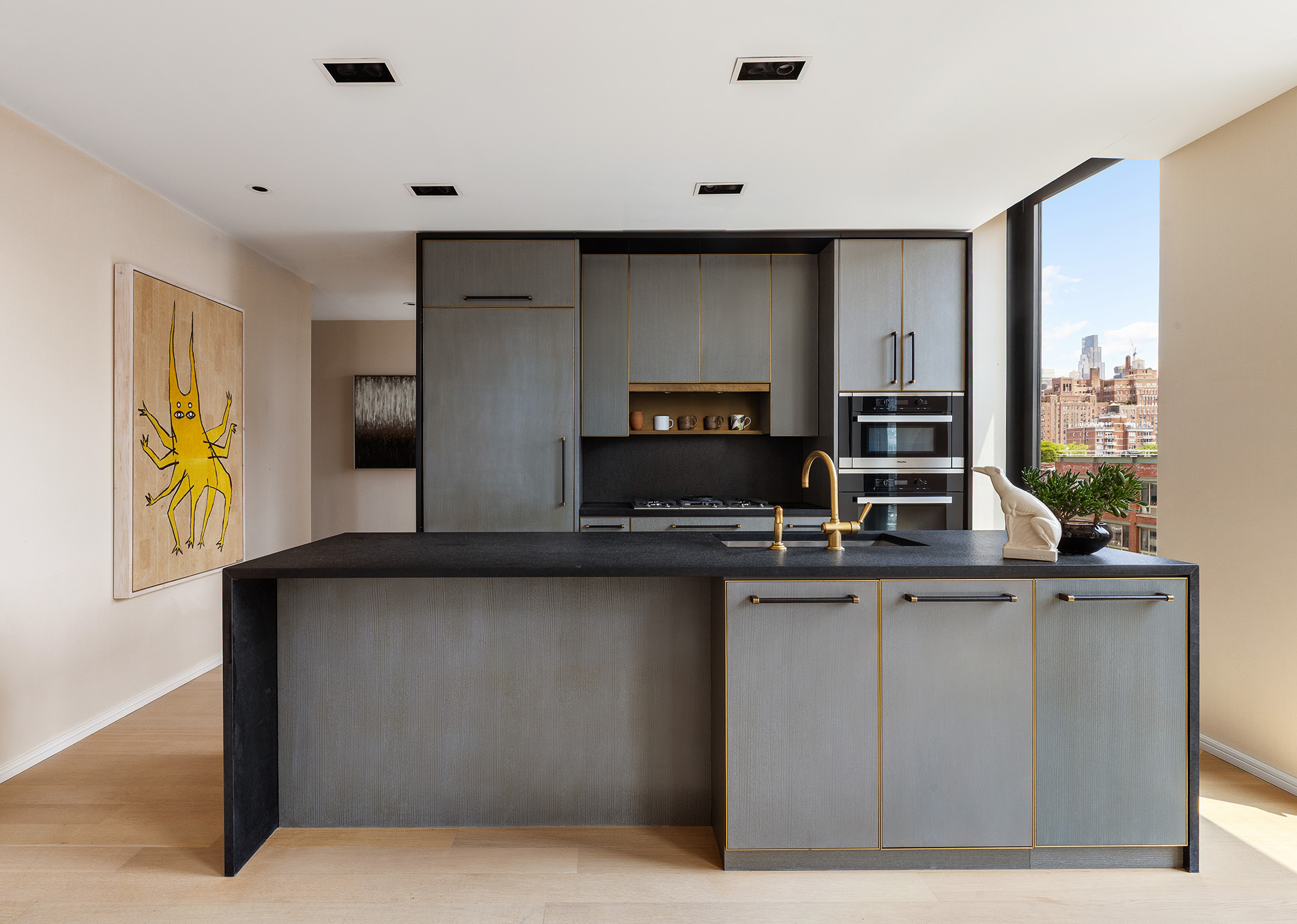 505 West 19th Street, Unit 7B Manhattan, NY 10011 - Photo 4 of 16 a kitchen with stainless steel appliances a sink and a refrigerator