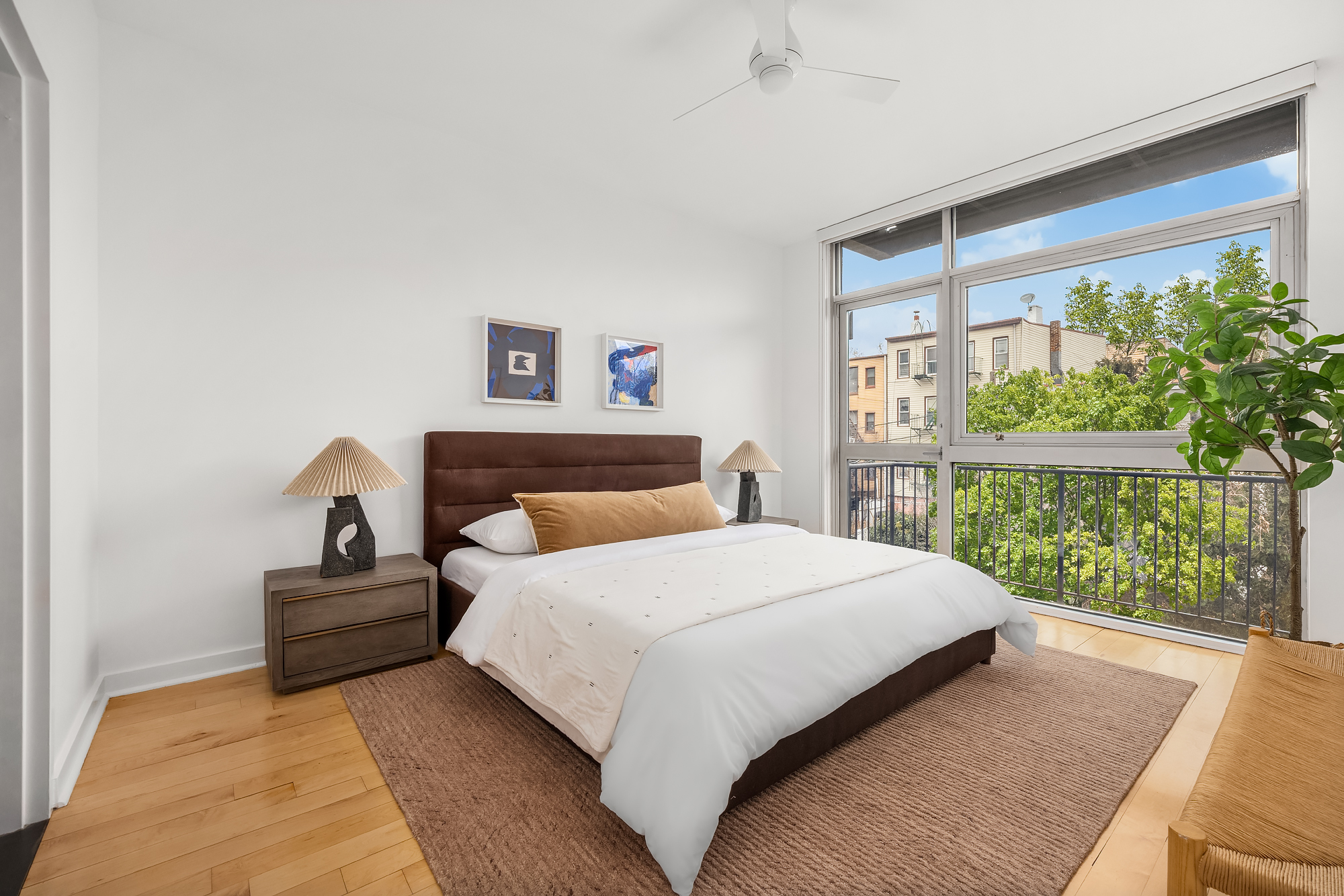 82 Guernsey Street, Unit 2A Brooklyn, NY 11222 - Photo 9 of 16 a bedroom with a large bed and a large window