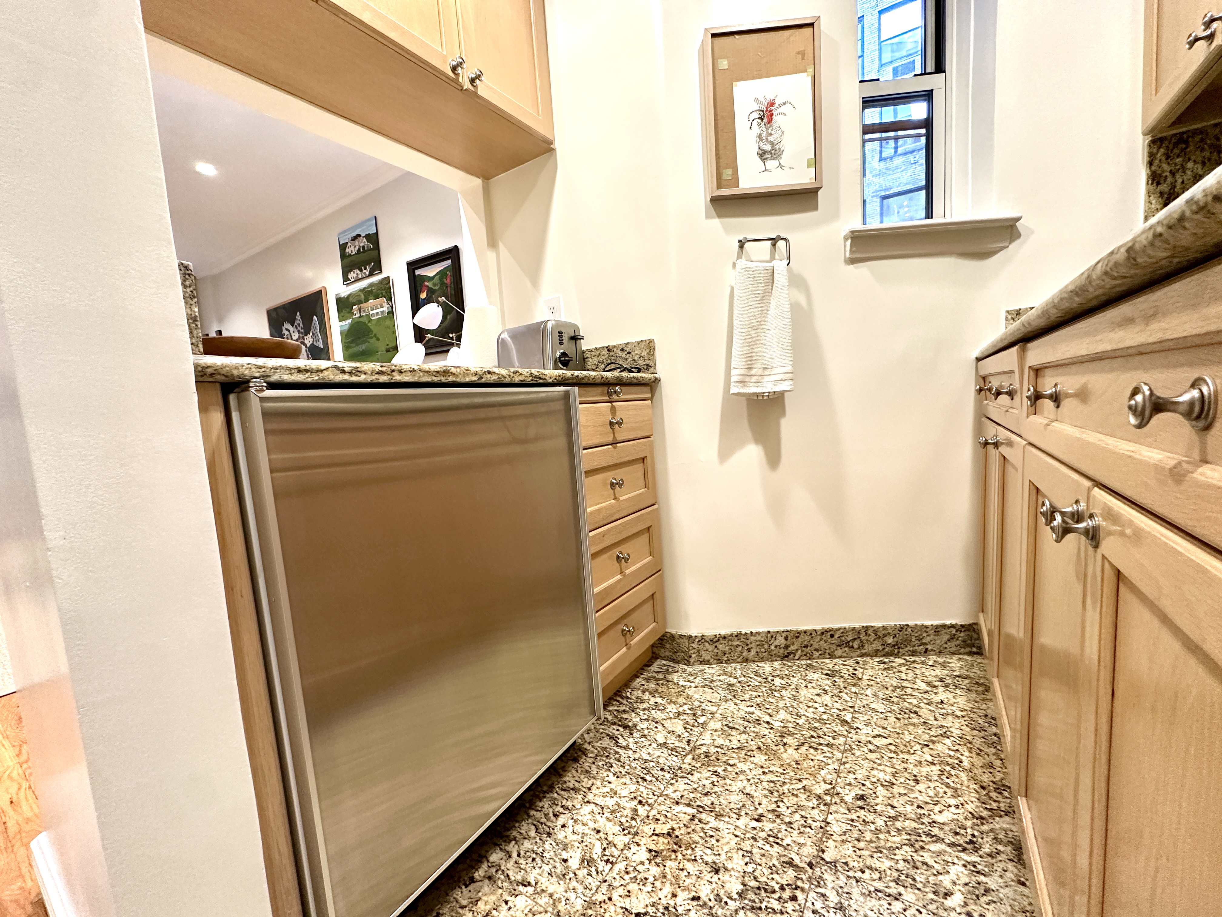 20 East 88th Street, Unit 5B Manhattan, NY 10128 - Photo 3 of 8 a view of a bathroom with mirror on the wall
