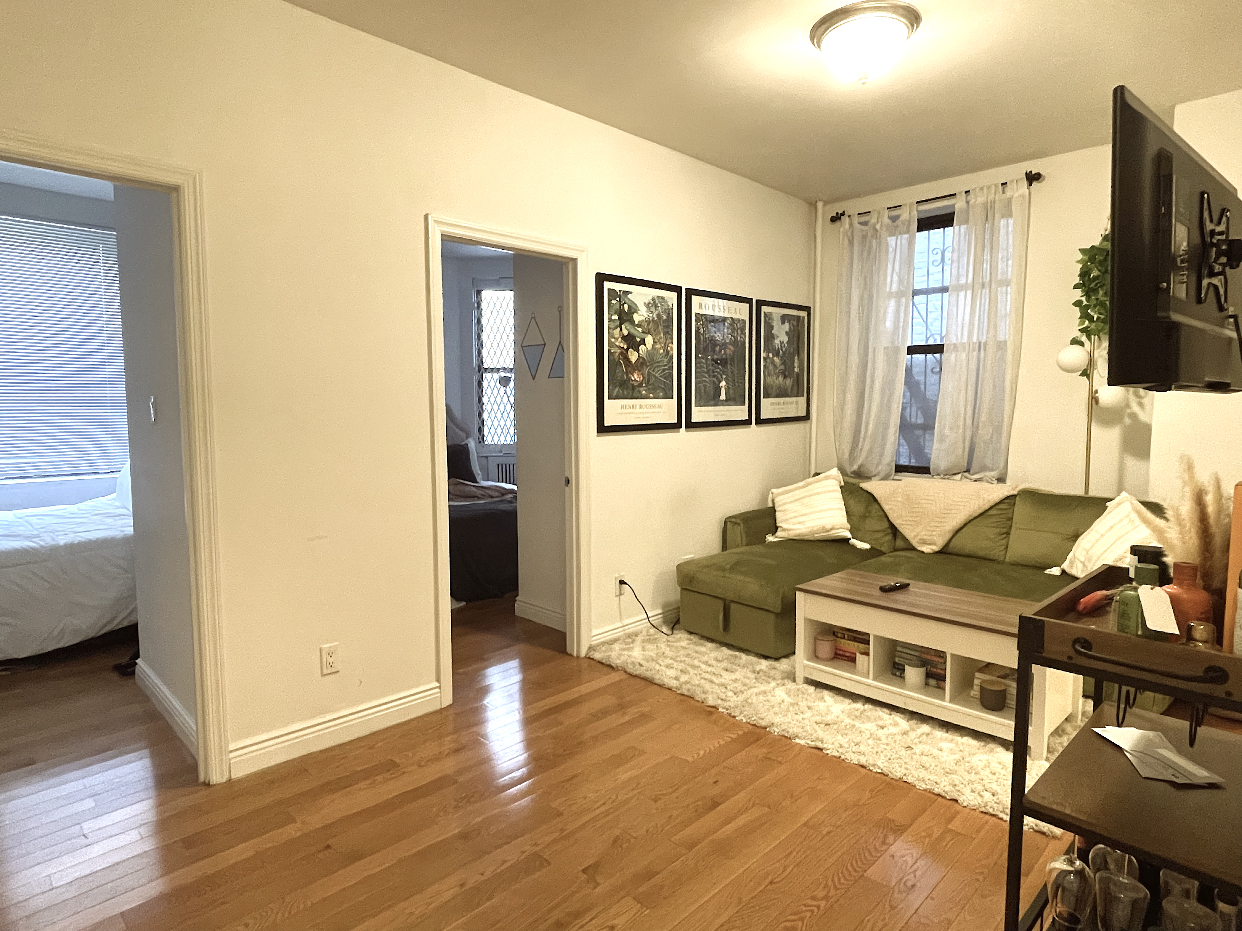 1716 2nd Avenue, Unit 4D Manhattan, NY 10128 - Photo 3 of 10 a living room with furniture and a flat screen tv