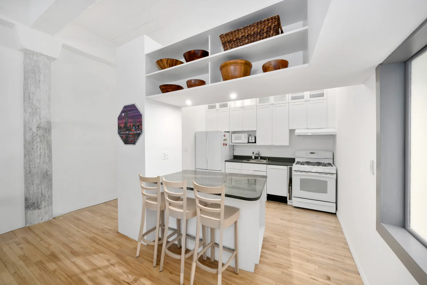 a kitchen with a stove cabinets and a refrigerator
