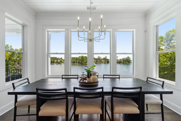a kitchen with stainless steel appliances granite countertop a lot of cabinets and wooden floor