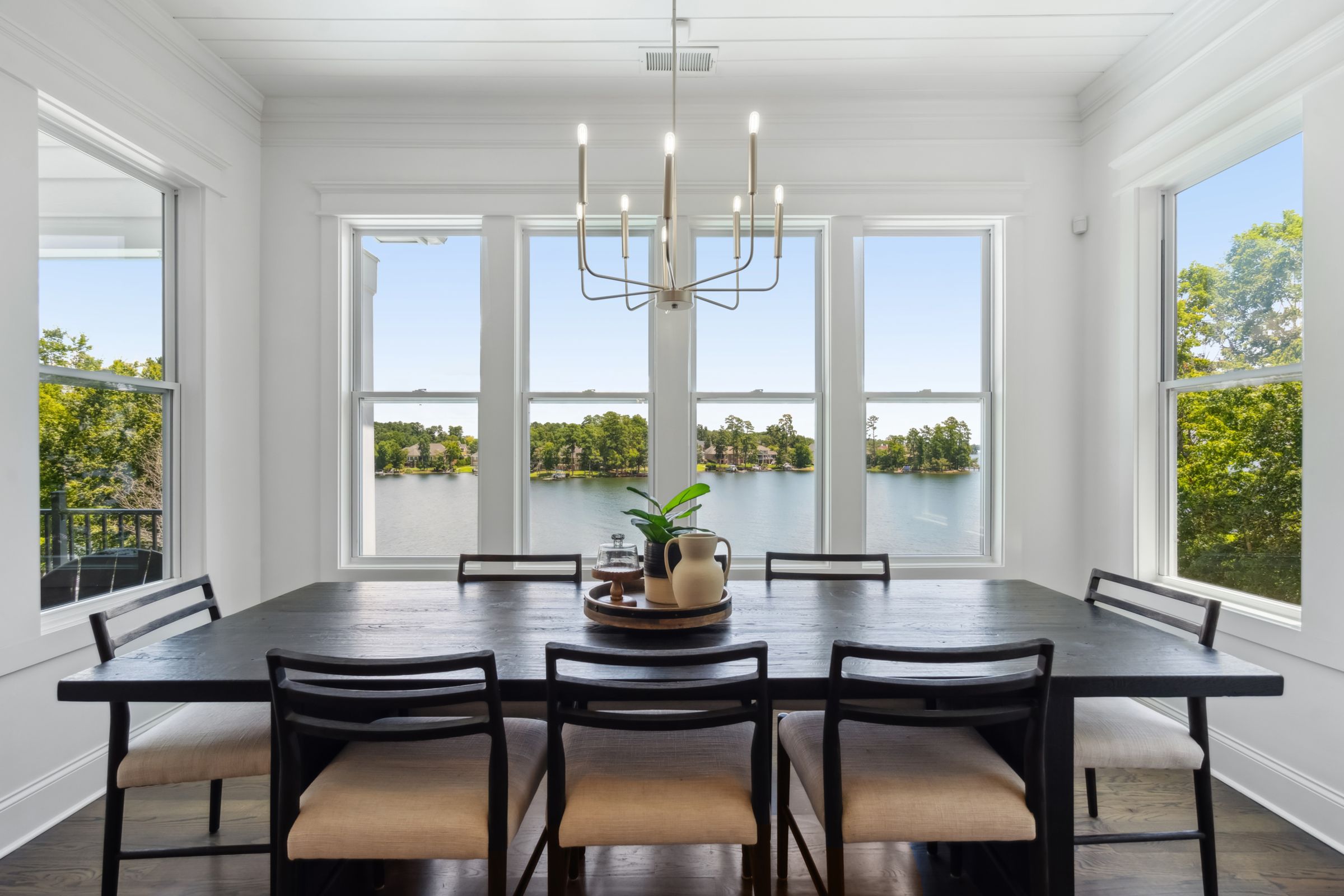 249 Pointe Overlook Drive Chapin, SC 29036 - Photo 16 of 56 a dining room with furniture a chandelier and wooden floor