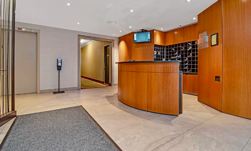251 East 32nd Street, Unit 5J Manhattan, NY 10016 - Photo 13 of 15 an empty room with wooden door