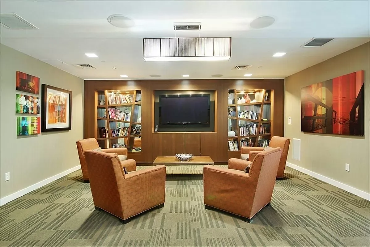 1 Northside Piers, Unit 18C Brooklyn, NY 11249 - Photo 10 of 12 a living room with furniture and a flat screen tv