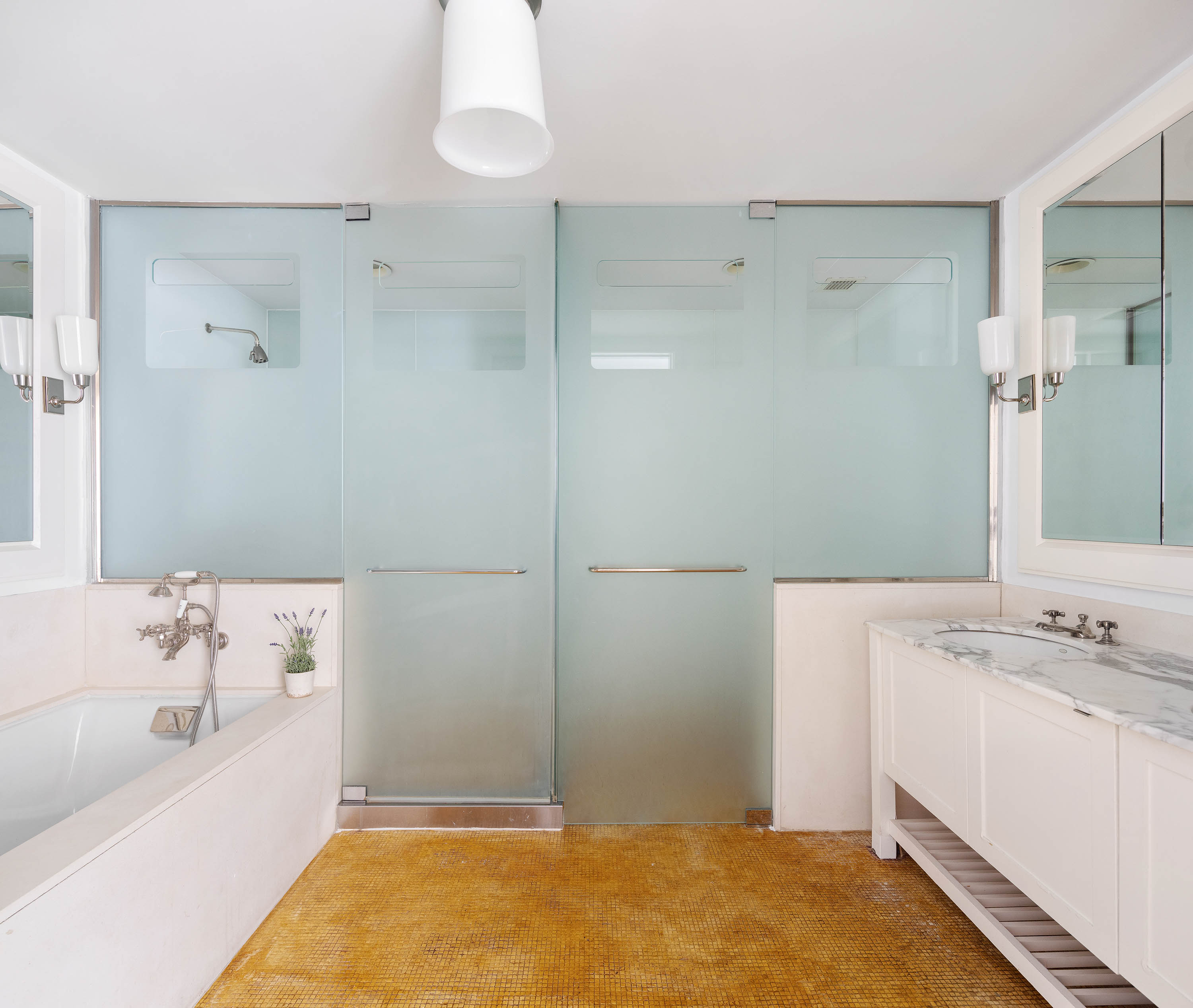 92 Laight Street, Unit 11A Manhattan, NY 10013 - Photo 8 of 15 a bathroom with a sink and a bathtub