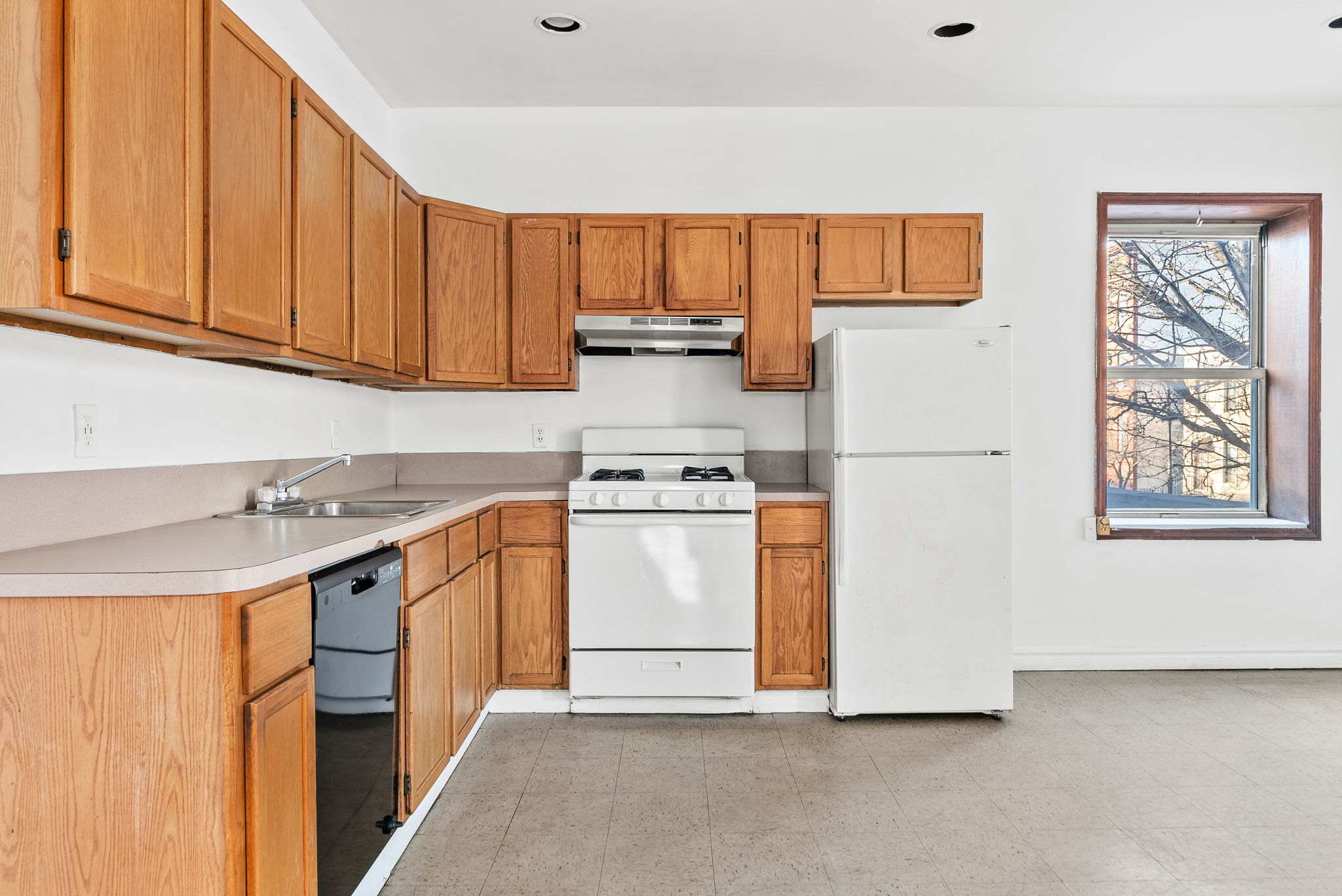 462 3rd Avenue, Unit 2 Brooklyn, NY 11215 - Photo 6 of 8 a kitchen with a stove and a white refrigerator