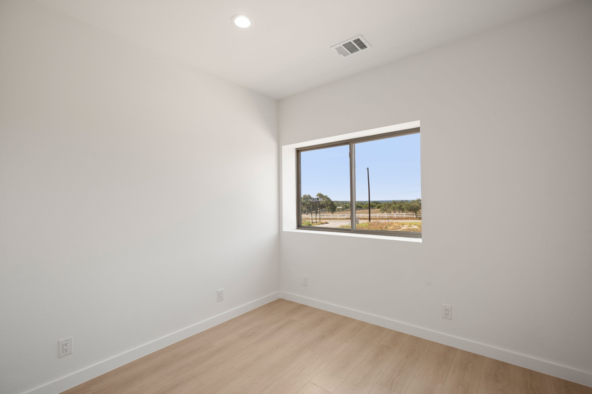 10020 Darden Hill Road, Unit 401 Austin, TX 78737 - Photo 24 of 50 an empty room with a window