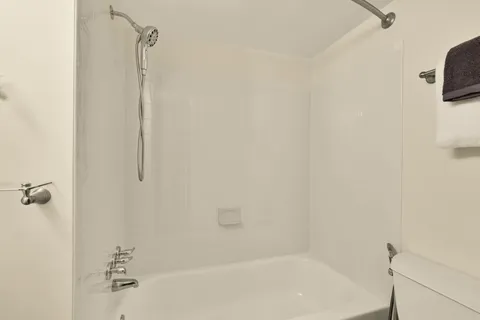 a view of a backyard with fence