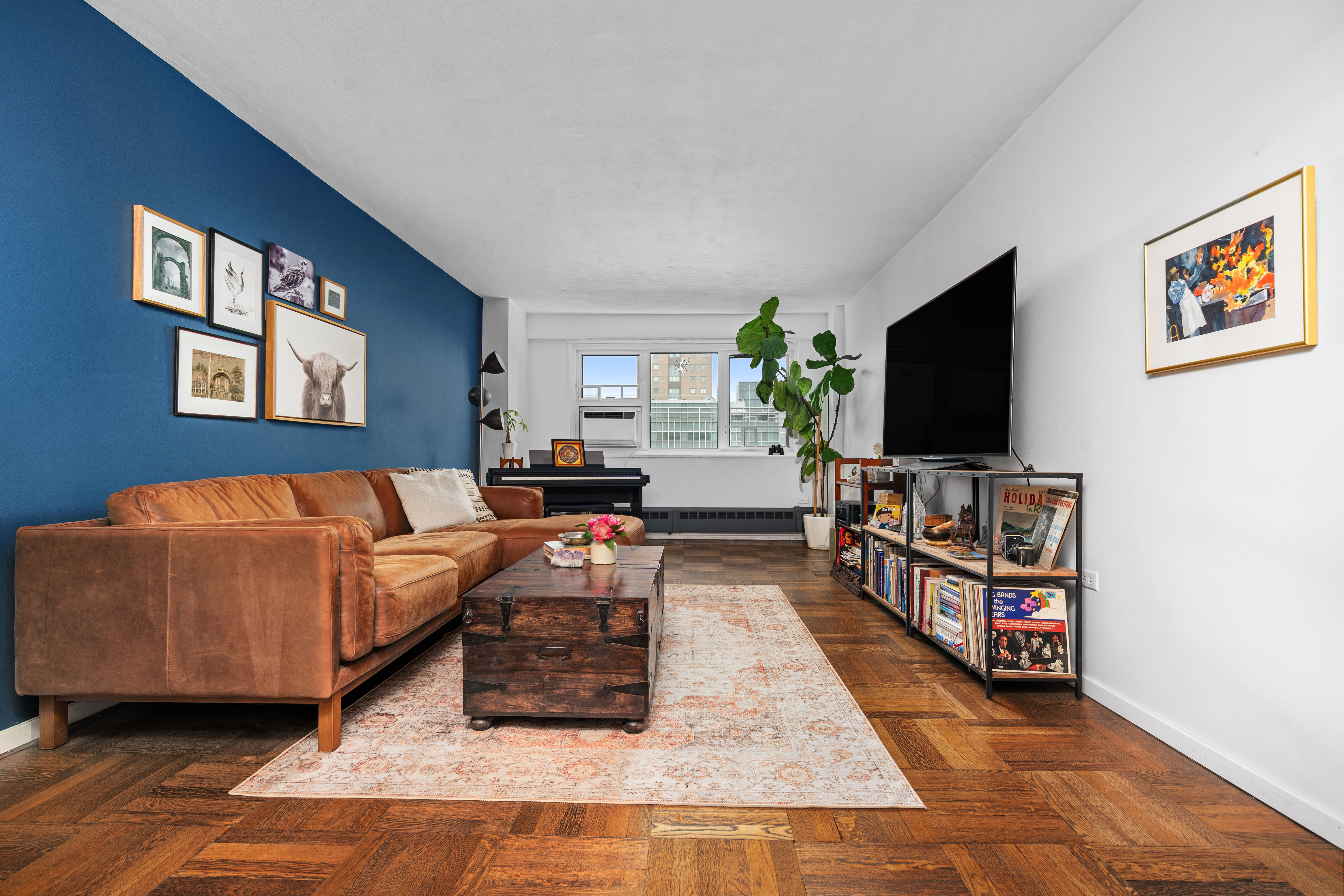 230 Jay Street, Unit 10H Brooklyn, NY 11201 - Photo 2 of 13 a living room with furniture and a flat screen tv