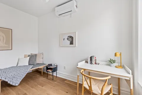 a workspace with furniture and window