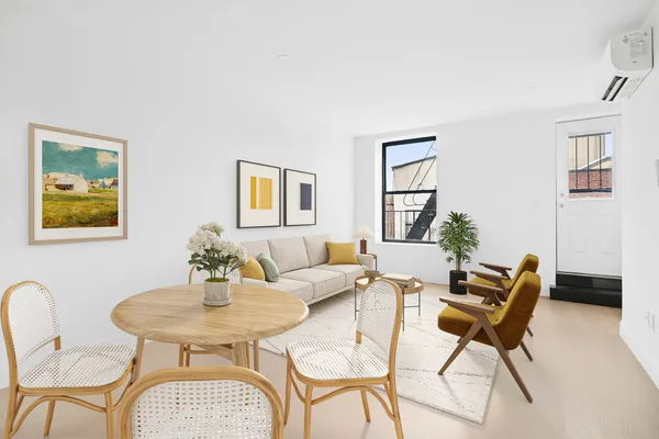 a dining room with furniture and window