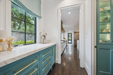 a hallway with view of wooden floor