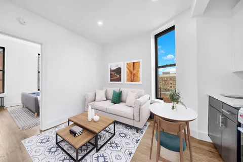 a living room with furniture and a couch