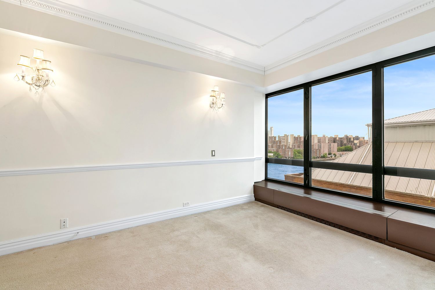 530 East 76th Street, Unit 10H Manhattan, NY 10021 - Photo 9 of 26 a view of an empty room with a window