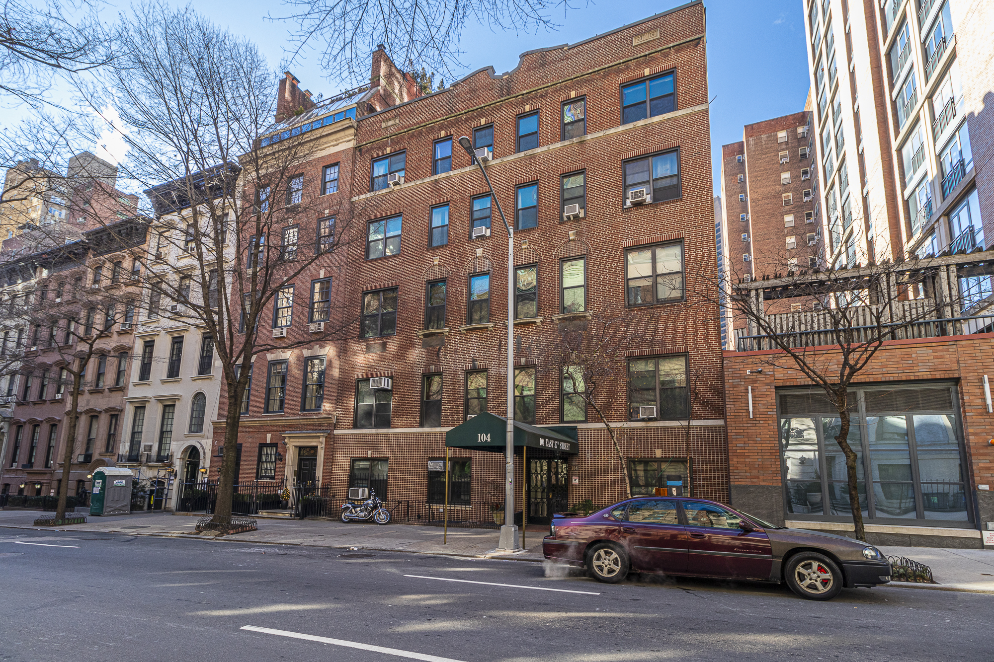 104 East 37th Street, Unit 5C Manhattan, NY 10016 - Photo 8 of 9 a car parked in front of a building