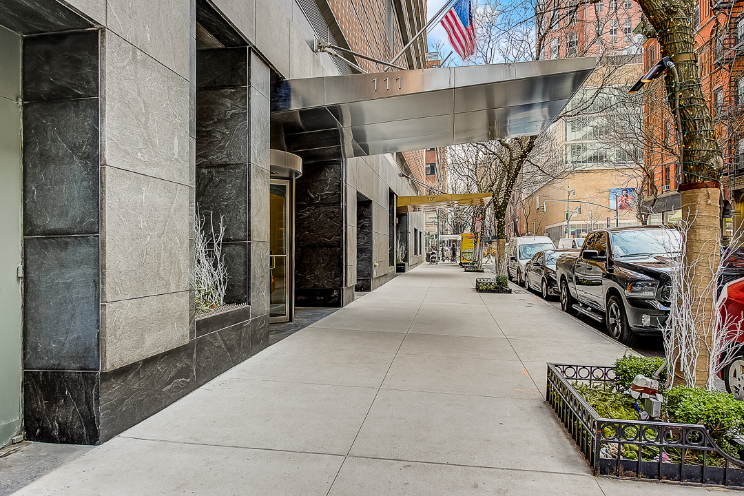 111 West 67th Street, Unit 24K Manhattan, NY 10023 - Photo 2 of 6 a view of a building with car parked
